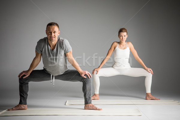 Couple practicing yoga Stock photo © LightFieldStudios