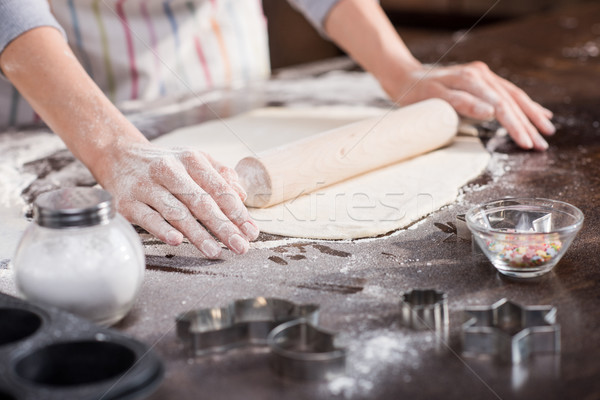 woman rolling raw dough Stock photo © LightFieldStudios