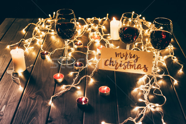 Red wine and merry christmas card Stock photo © LightFieldStudios