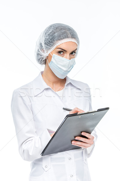Doctor holding clipboard Stock photo © LightFieldStudios