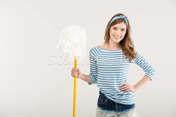 Young woman with mop Stock photo © LightFieldStudios