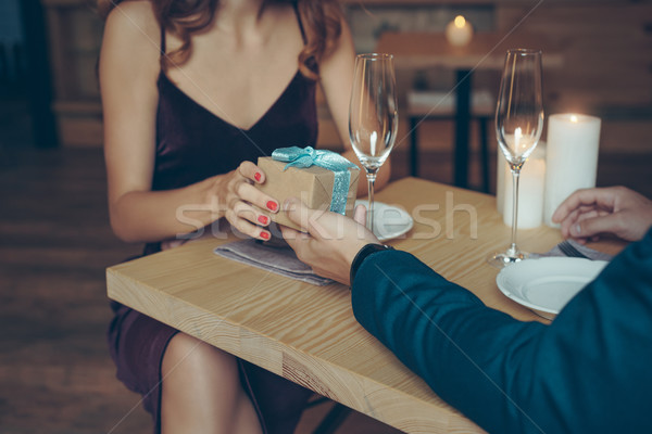 couple holding gift Stock photo © LightFieldStudios