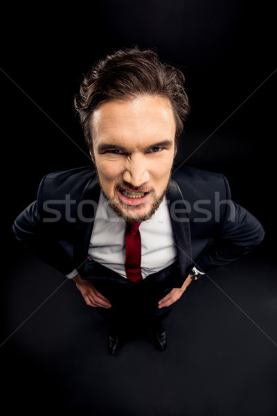 Annoyed businessman in formalwear  Stock photo © LightFieldStudios