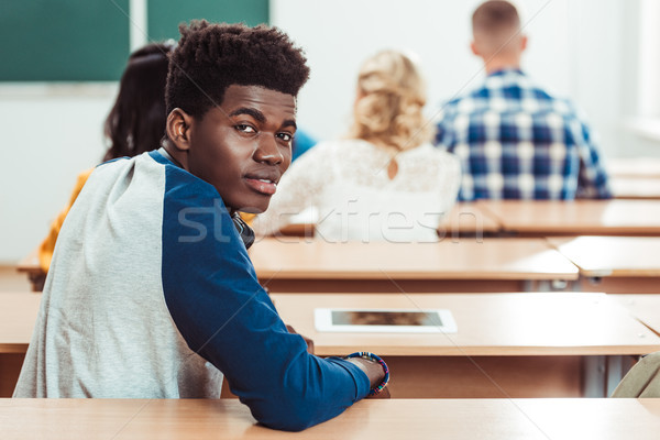 student sitting in classroom Stock photo © LightFieldStudios