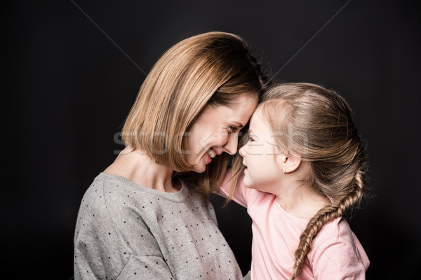 Feliz madre hija tocar sonriendo negro Foto stock © LightFieldStudios