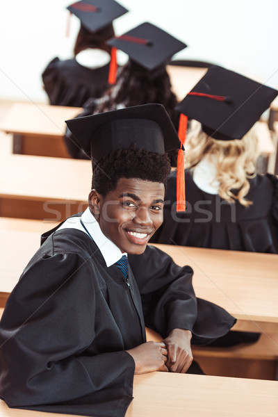 african american student in graduation costume Stock photo © LightFieldStudios
