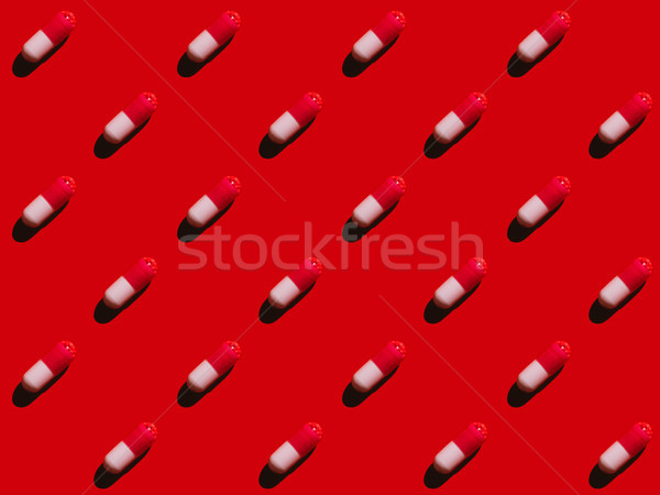 Orvosi tabletták közelkép kilátás piros háttér Stock fotó © LightFieldStudios
