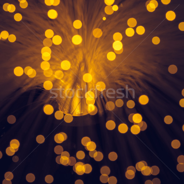 close up of blurred glowing orange fiber optics texture Stock photo © LightFieldStudios