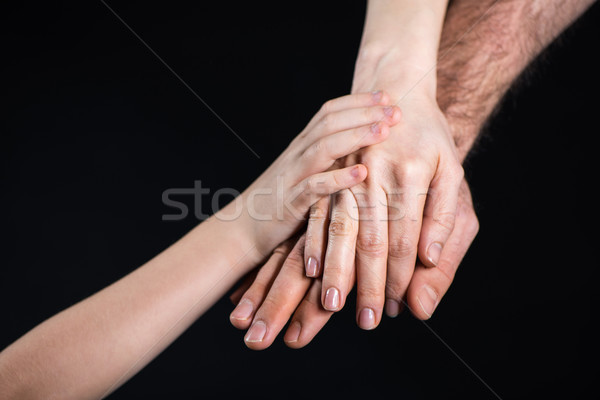 Family stacking hands Stock photo © LightFieldStudios