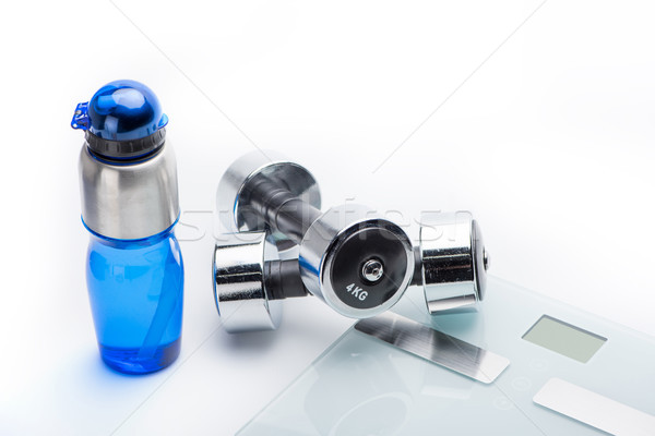 metallic dumbbells, scales and sport bottle isolated on white. drink water, equipment sport and heal Stock photo © LightFieldStudios