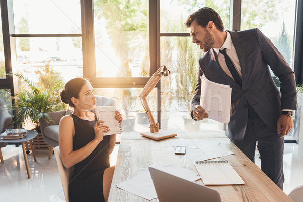 Businessman reprehending secretery Stock photo © LightFieldStudios