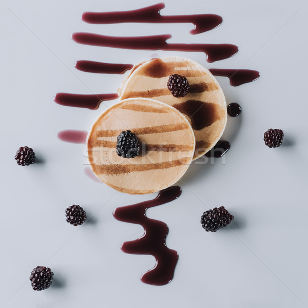 top view of tasty pancakes with fresh blackberries and jam on grey   Stock photo © LightFieldStudios