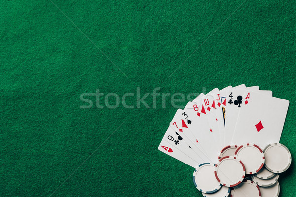 Gambling concept with cards and chips on casino table Stock photo © LightFieldStudios
