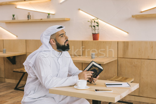 muslim man with quran Stock photo © LightFieldStudios