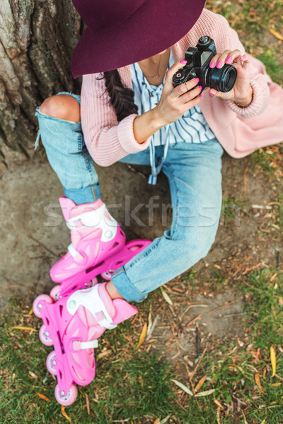 girl in roller skates with camera Stock photo © LightFieldStudios