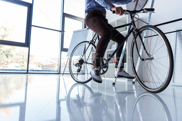 businessman with bicycle in office Stock photo © LightFieldStudios