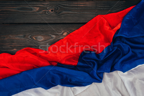 close up view of russian flag on dark wooden surface Stock photo © LightFieldStudios