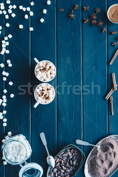 cups of cacao drink and various spices Stock photo © LightFieldStudios