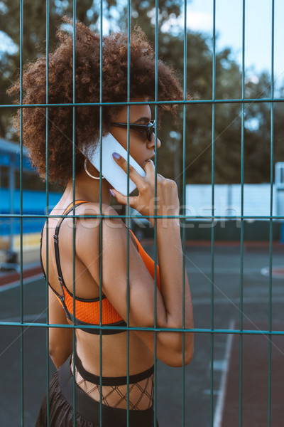 african-american woman talking on smartphone Stock photo © LightFieldStudios