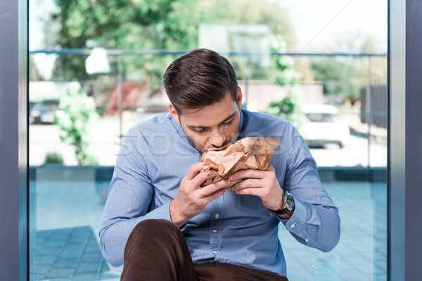 Stock photo: businessman eating hamburger
