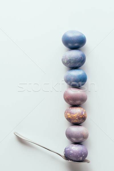 Felső kilátás festett húsvéti tojások csetepaté kanál Stock fotó © LightFieldStudios