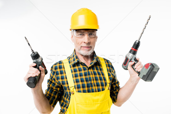 Workman holding electric drills Stock photo © LightFieldStudios