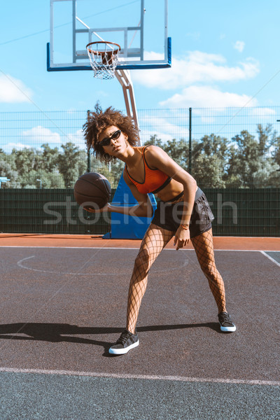 Nő kosárlabda fiatal viselet labda sportok Stock fotó © LightFieldStudios
