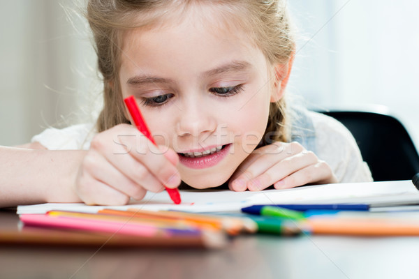 Happy mother and daughter drawing at home Stock photo © LightFieldStudios