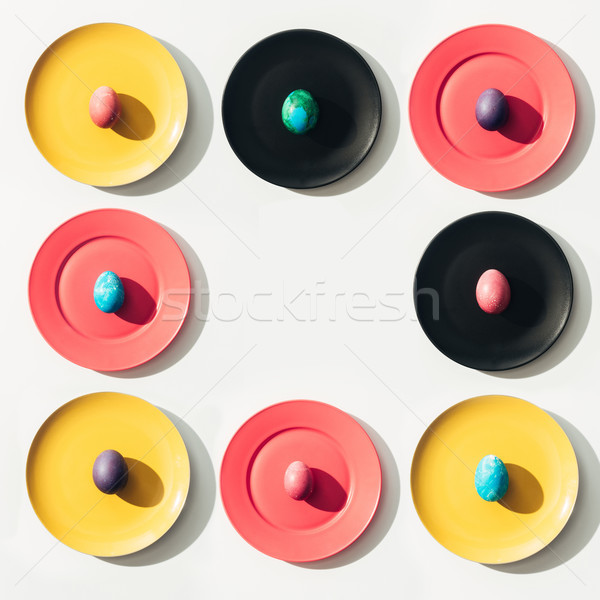 Keret húsvéti tojások színes tányérok copy space tavasz Stock fotó © LightFieldStudios