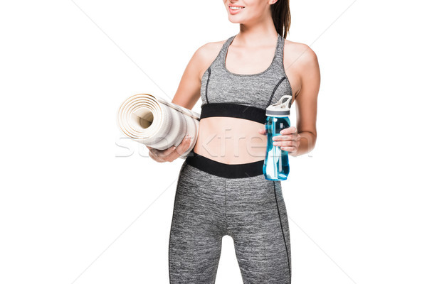 sportswoman with yoga mat and bottle of water Stock photo © LightFieldStudios