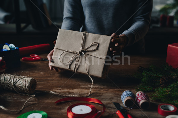 woman showing christmas gift Stock photo © LightFieldStudios