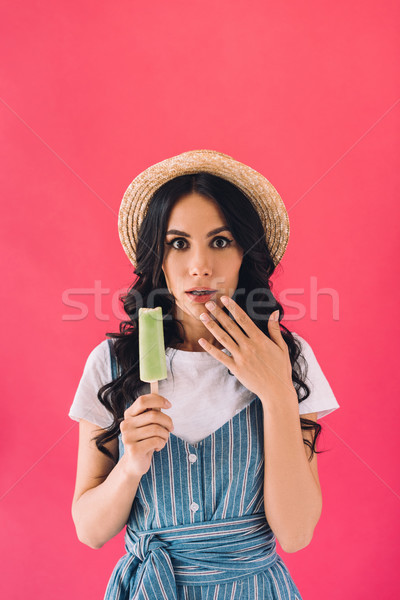 shocked woman with popsicle Stock photo © LightFieldStudios