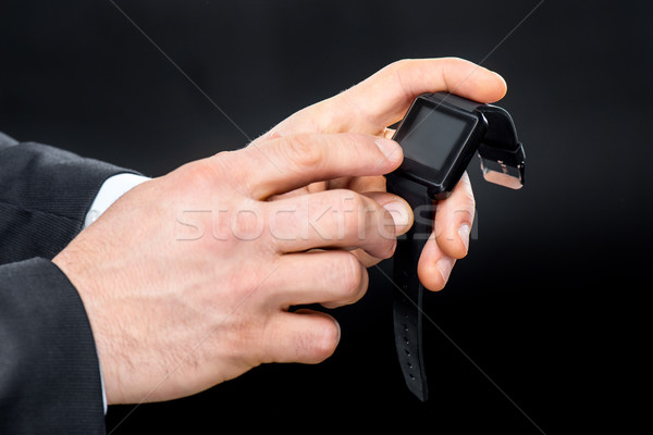Man using smartwatch Stock photo © LightFieldStudios