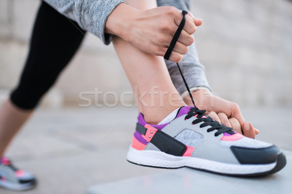 tying shoelaces on sneakers Stock photo © LightFieldStudios