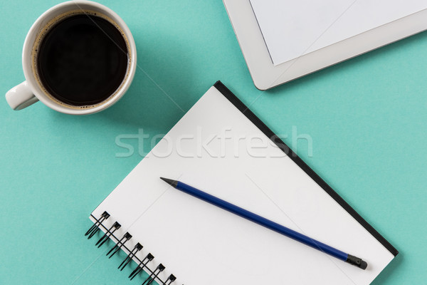 Stock photo: top view of notebook with cup of coffee and digital tablet mock-up, small office home office