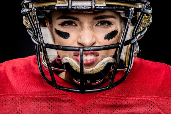 Americano futbolista casco primer plano retrato femenino Foto stock © LightFieldStudios
