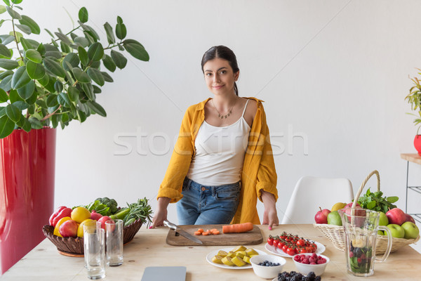 woman at table with organic food Stock photo © LightFieldStudios