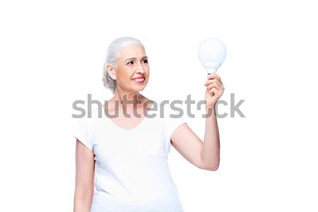 Stockfoto: Senior · vrouw · gloeilamp · glimlachend · geïsoleerd