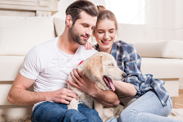 Young couple with puppy  Stock photo © LightFieldStudios