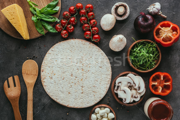 top view of pizza dough with various vegetables for topping on concrete table Stock photo © LightFieldStudios