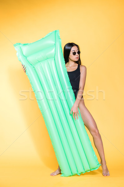 woman in swimsuit with pool mattress Stock photo © LightFieldStudios
