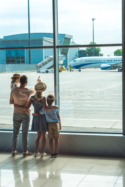 family looking out window in airport Stock photo © LightFieldStudios