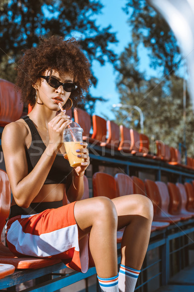 женщину сока молодые оранжевый пить Сток-фото © LightFieldStudios