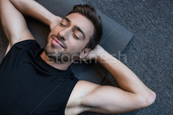 男子 瑜伽墊 閉眼 年輕人 手 背後 商業照片 © LightFieldStudios
