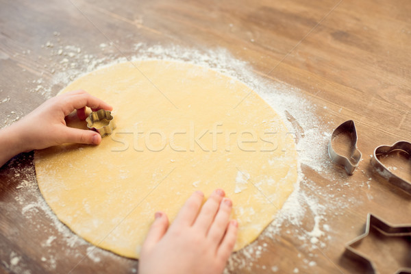 partial view of boy making shaped cookies with cookie cutter Stock photo © LightFieldStudios