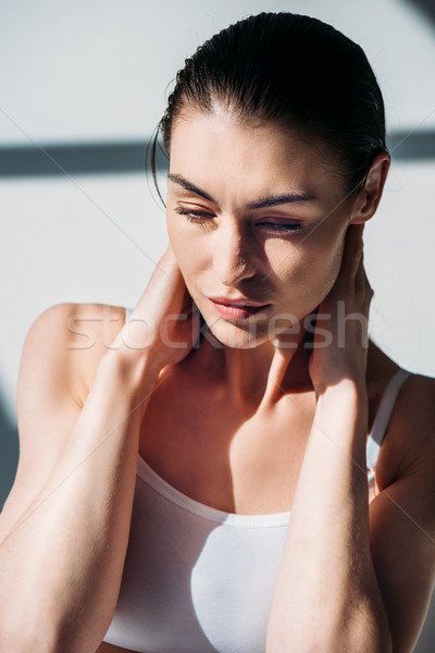 woman slicking back wet hair Stock photo © LightFieldStudios