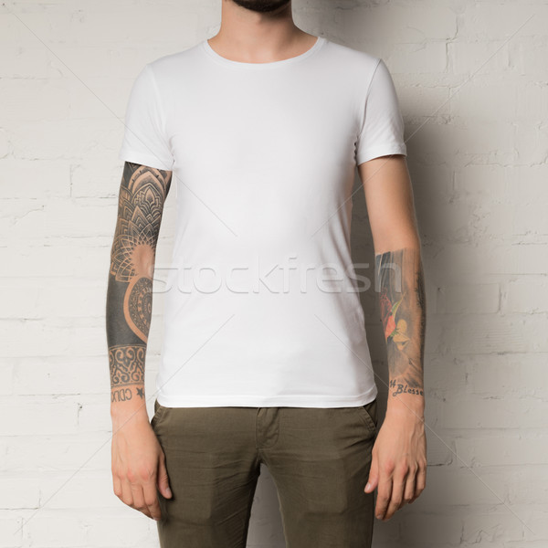 Adam beyaz tshirt atış moda tek başına Stok fotoğraf © LightFieldStudios
