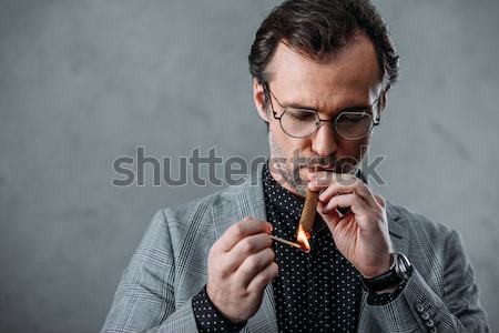 Stock photo: businessman smoking cigar