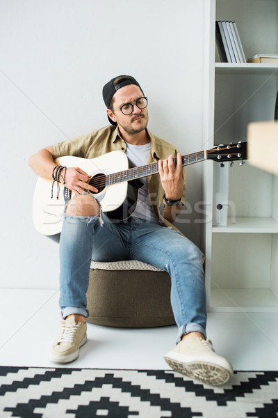 Homme jouer guitare élégant guitare acoustique [[stock_photo]] © LightFieldStudios