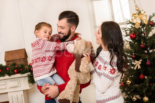 happy family with teddy bear at christmas Stock photo © LightFieldStudios